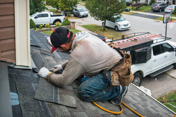 Professional Roofing technician working in Northville, MI
